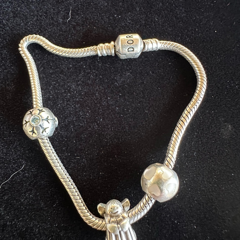 Pandora Silver Charm Bracelet with Intricate Designs Three charms